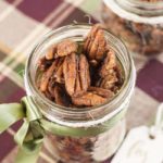 Close up view of a Mason jar gift of Low-Carb Pumpkin Spice Roasted Pecans