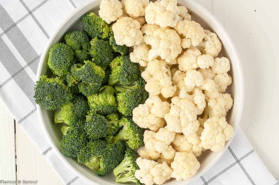 Preparing Vegetables for Cheesy Bacon Broccoli Cauliflower Casserole with Bacon.