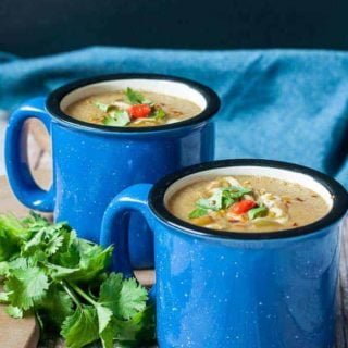 Two blue mugs of Slow Cooker Moroccan Harissa Cauliflower Soup