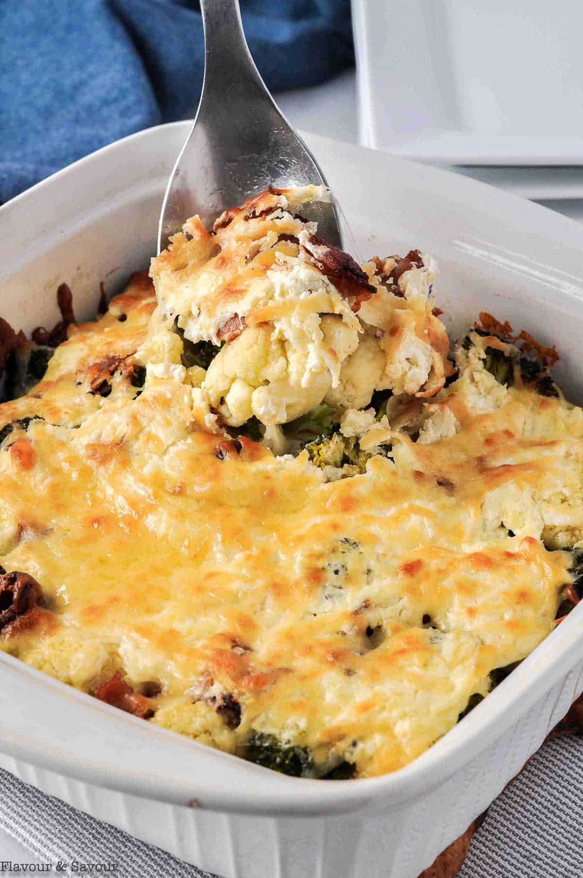 A spoonful of Cheesy Bacon Broccoli Cauliflower Casserole.