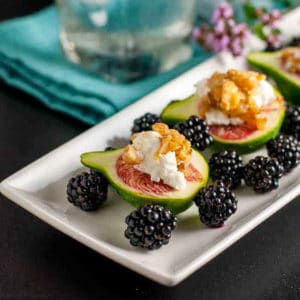 Fresh figs with goat cheese served with fresh blackberries