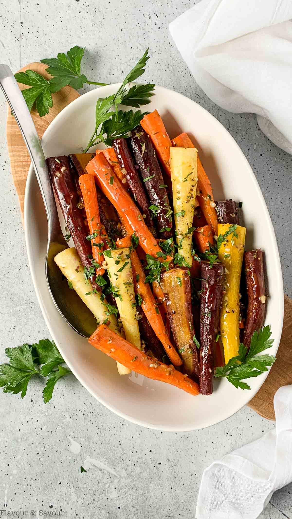 Overhead view of a bowl of roasted honey Dijon carrots.