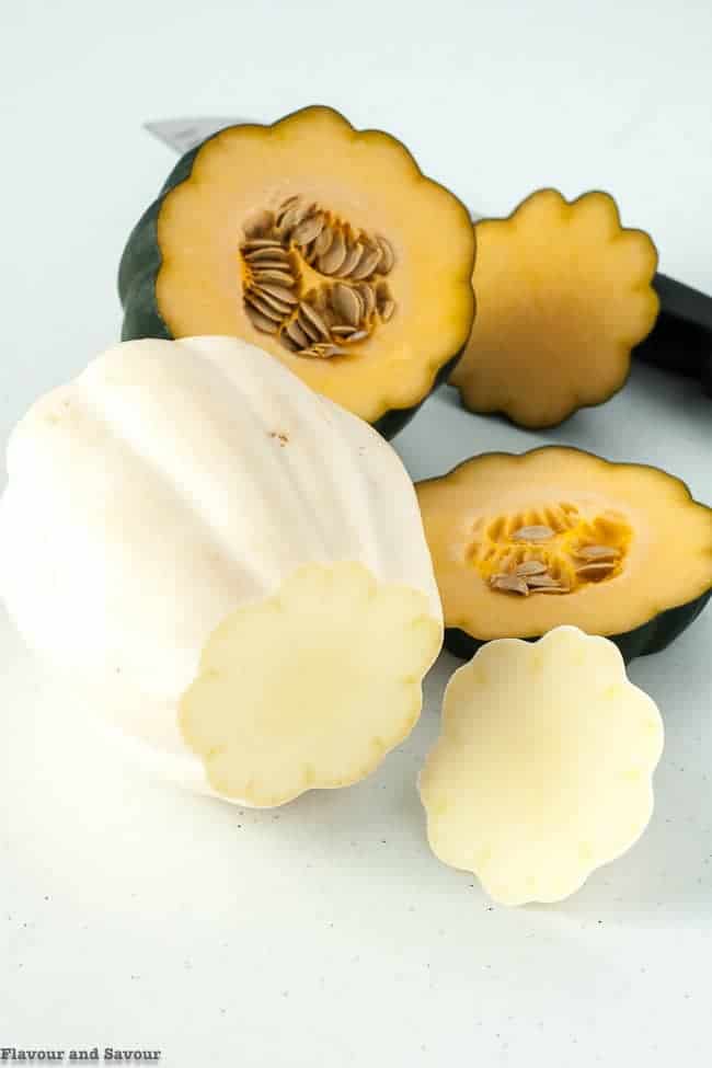 White skinned and green acorn squash for Garlic Parmesan-Crusted Roasted Acorn Squash