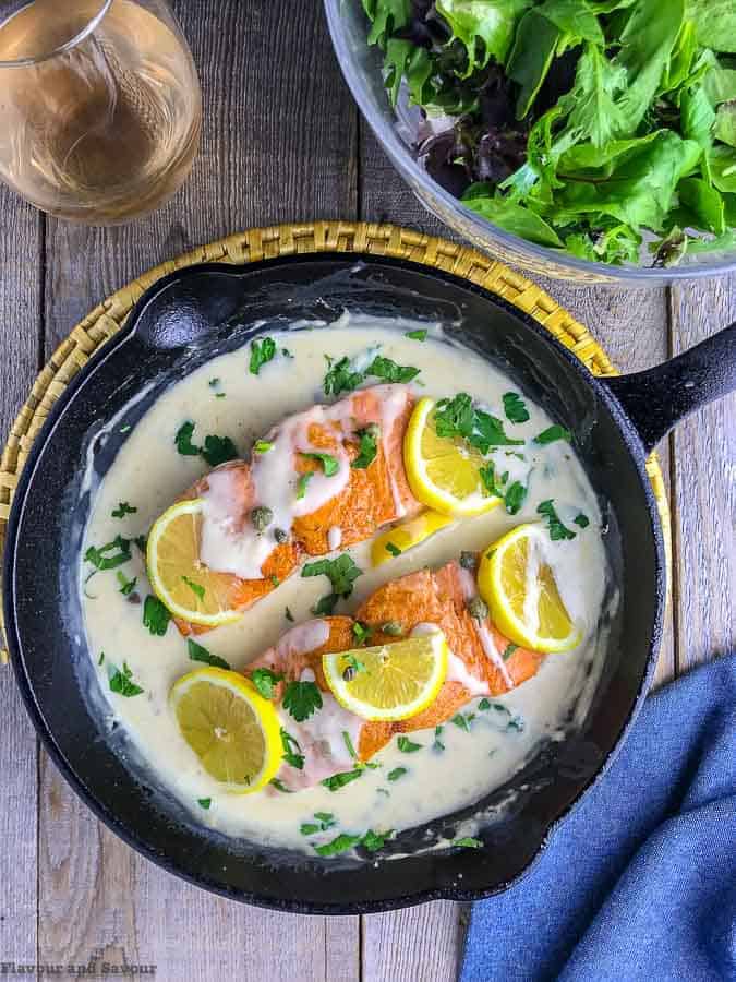 30-minute Creamy Lemon Salmon PIccata in cast iron skillet