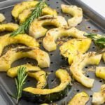 Garlic Parmesan-Crusted Roasted Acorn Squash on baking sheet