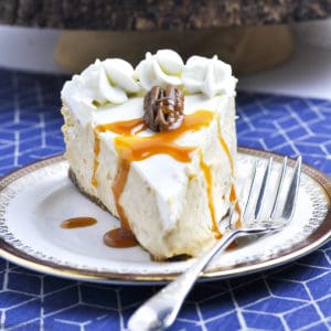 slice of pumpkin cheesecake on a plate with a fork