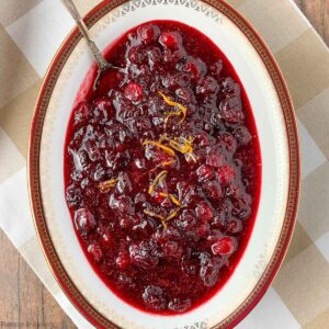 A bowl of cranberry orange sauce with spices