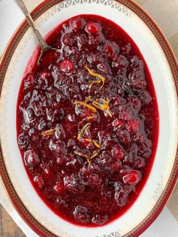 A bowl of cranberry orange sauce with spices
