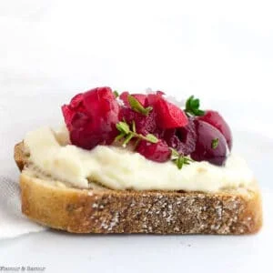 Close up view of a Cranberry Whipped Ricotta Crostini appetizer.