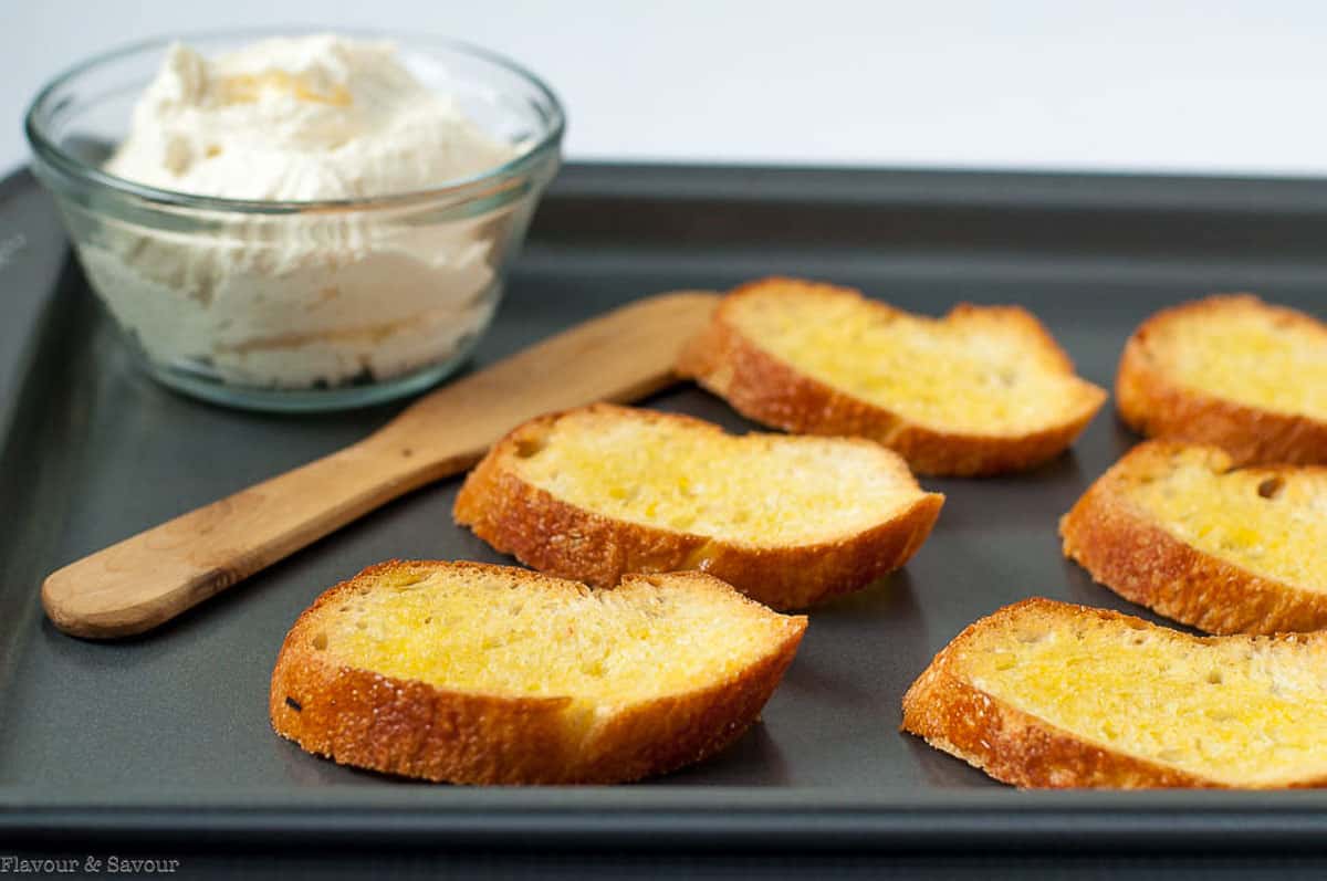 Toasted baguette slices to make crostini appetizers.