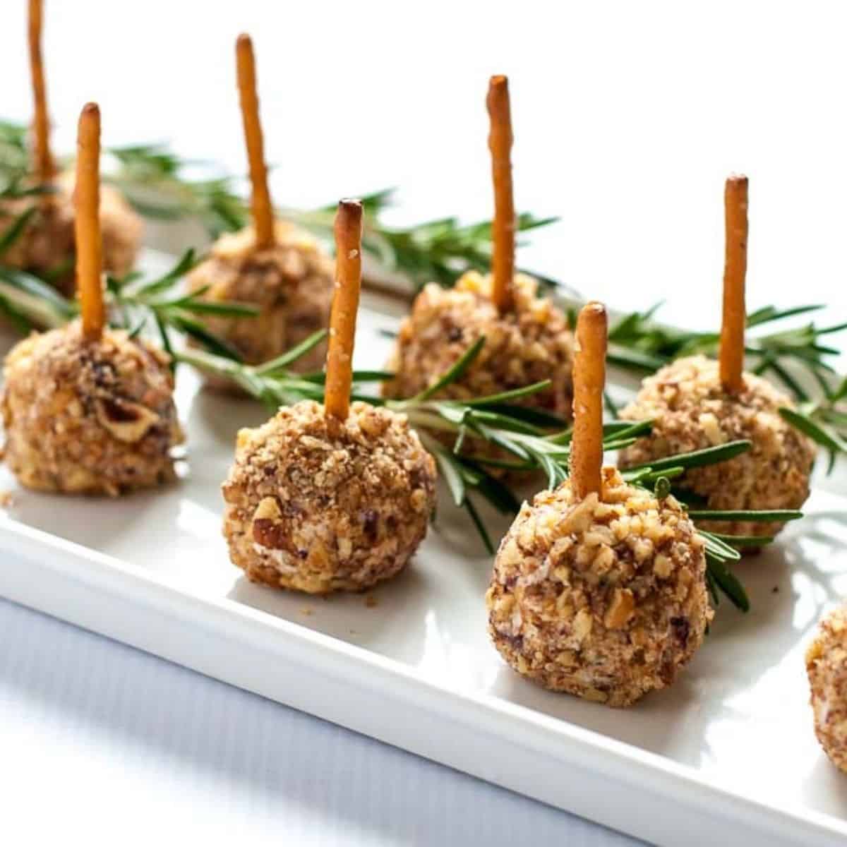 mini cheese balls on a stick, one of 20 easy finger food appetizer recipes