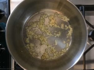 sauteeing onions for Mini Spinach Artichoke Tarts