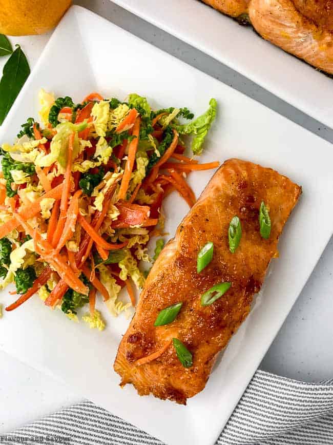 Close up overhead view of Citrus Glazed Baked Salmon with Sake  served with coleslaw.