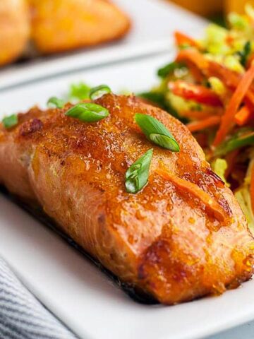 Citrus Glazed Salmon with Sake on a plate with coleslaw