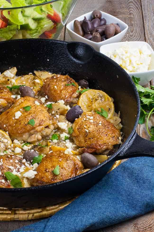 One Pan Baked Lemon Artichoke Chicken Thighs in a cast iron skillet