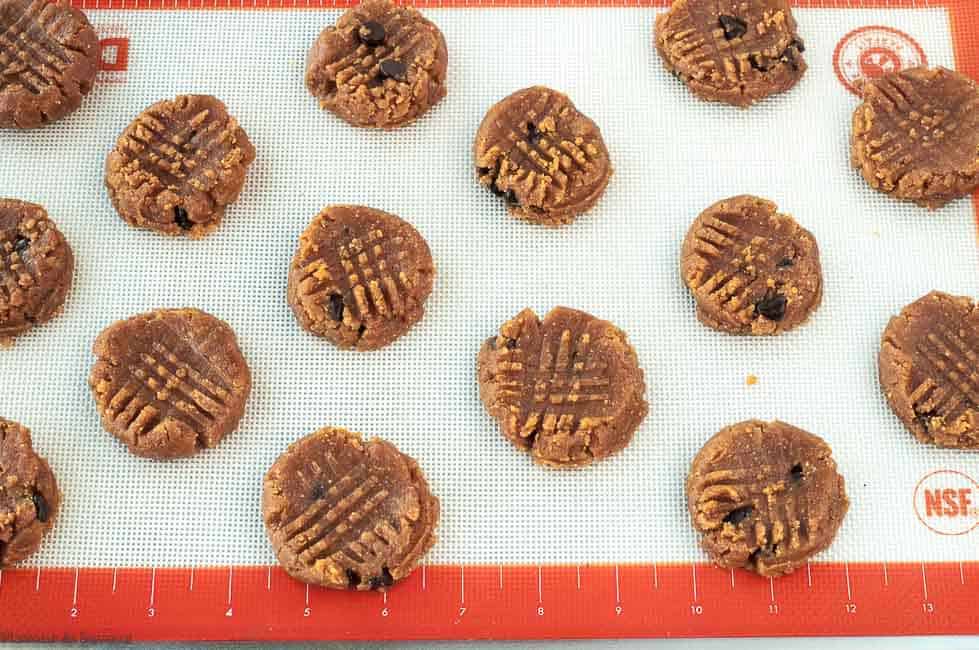 Cross hatching cookies on a silicone baking mat