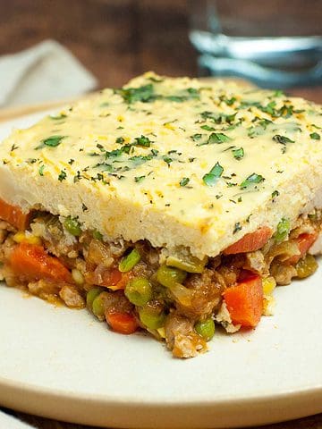 A serving of Shepherd's pie with mashed cauliflower crust on a plate.