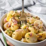 A forkful of New Potato Salad with Pickled Shallots