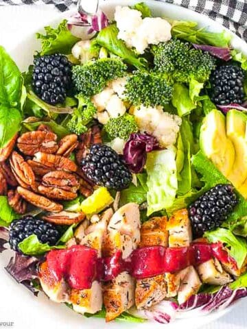 Overhead view of a bowl of blackberry balsamic grilled chicken salad.