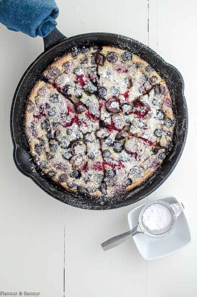 Cherry Berry Gluten-Free Clafoutis in a cast iron skillet