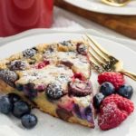 Two wedges of Gluten-Free Clafoutis with berries