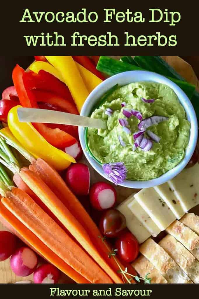 Avocado Feta Dip with fresh basil surrounded by fresh veggies