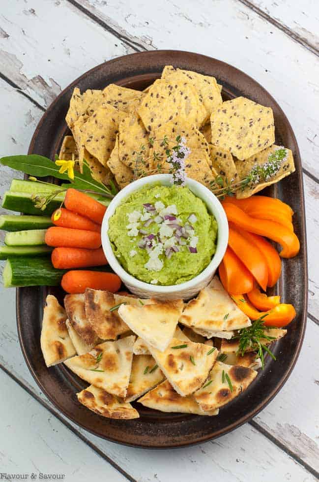 Avocado Feta Herb Dip with pita chips and crudites