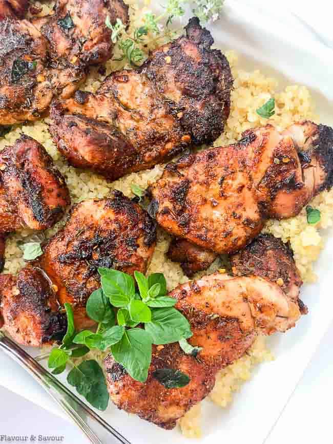 Cajun Chicken Thighs with fresh oregano leaves