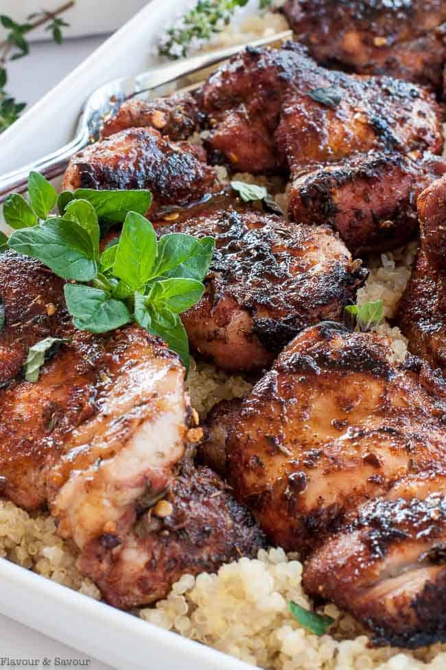 Close up view of Cajun Chicken with a sprig of oregano