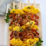 Grilleld Cajun Shrimp and Pineapple Kabobs on a white plate