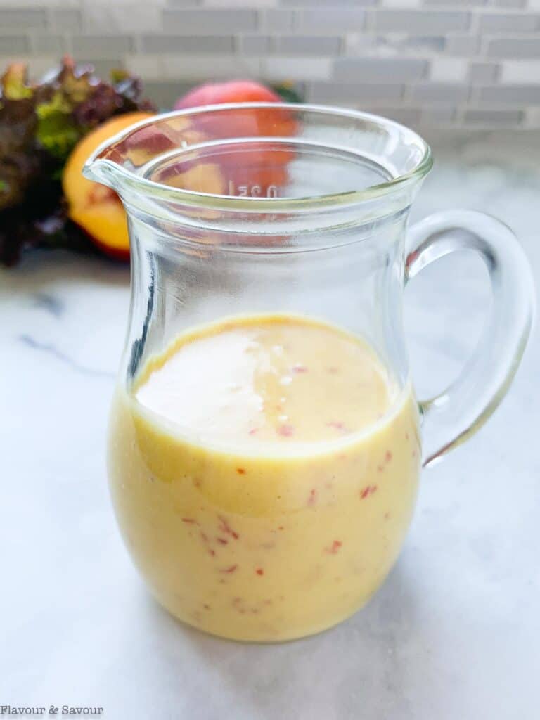 Sweet Peach Salad Dressing in a small pitcher