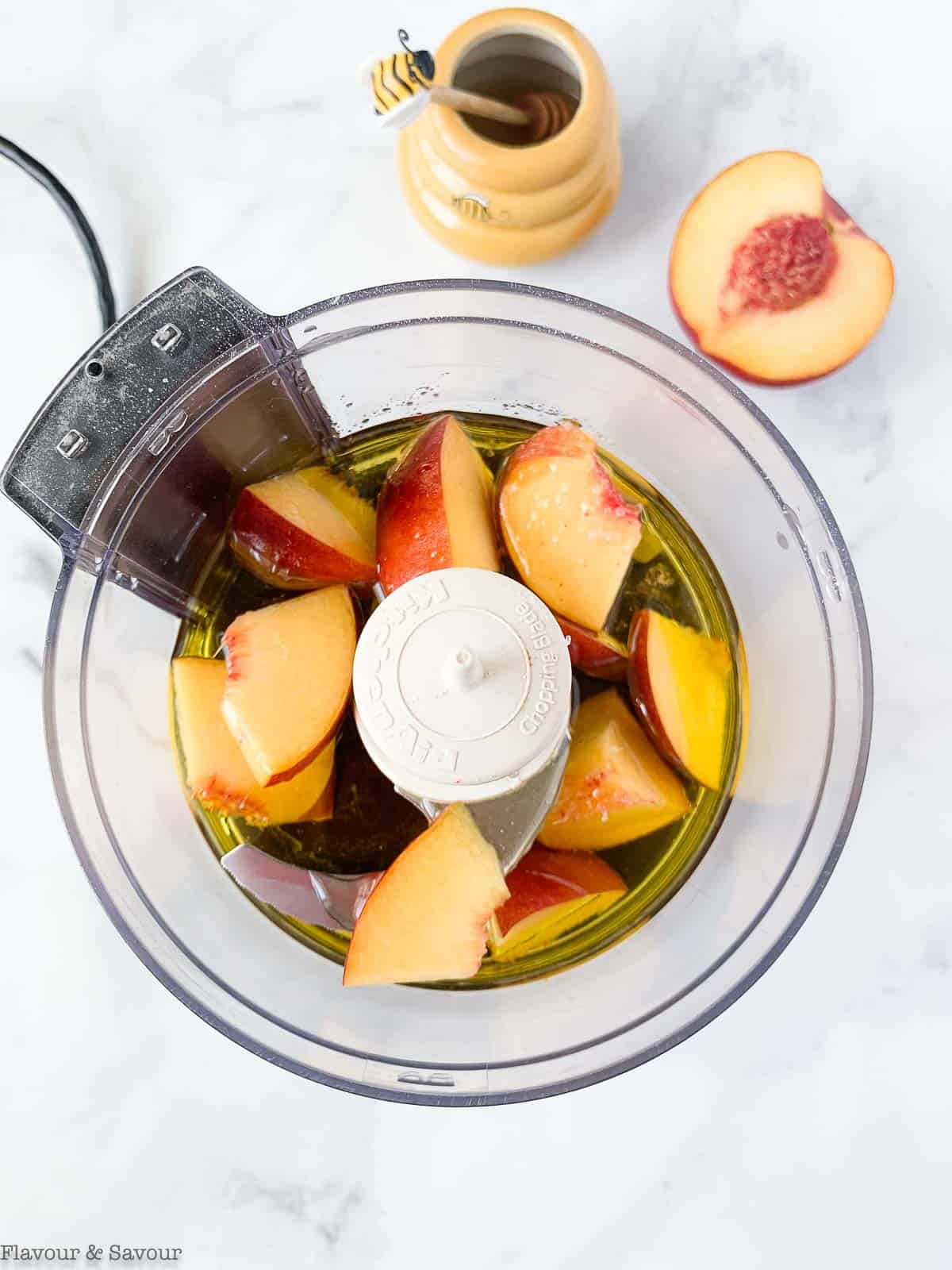 Sweet peach salad dressing ingredients in a blender