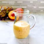 a small pitcher of Sweet Peach Salad Dressing