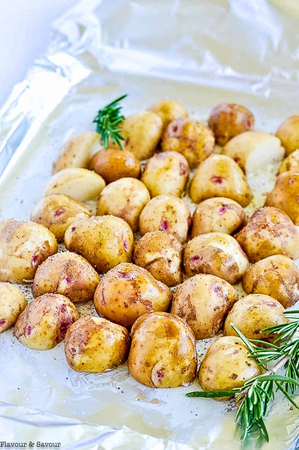 Baby potatoes on a sheet of aluminum foil.