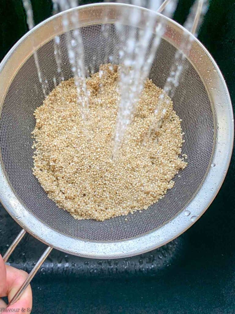 rinsing quinoa in a sieve