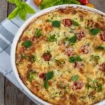 A baked dish of Crustless Cheesy Zucchini Quiche