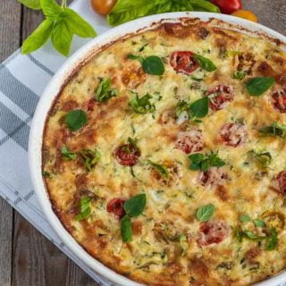 A baked dish of Crustless Cheesy Zucchini Quiche