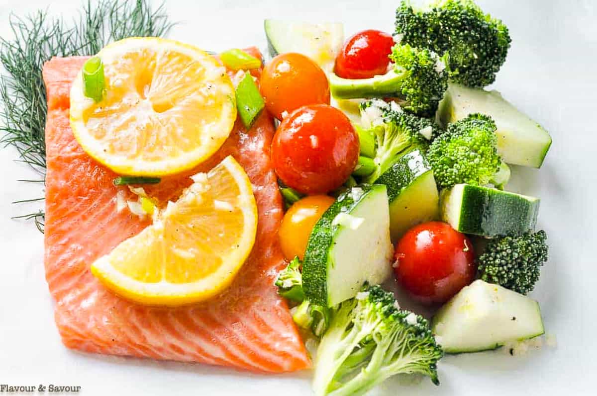 Assembling salmon packets to grill.