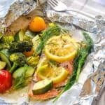 Wild salmon and vegetables cooked in a foil packet.