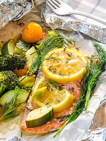 Wild salmon and vegetables cooked in a foil packet.