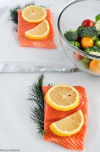 Preparing salmon for grilling in foil packets