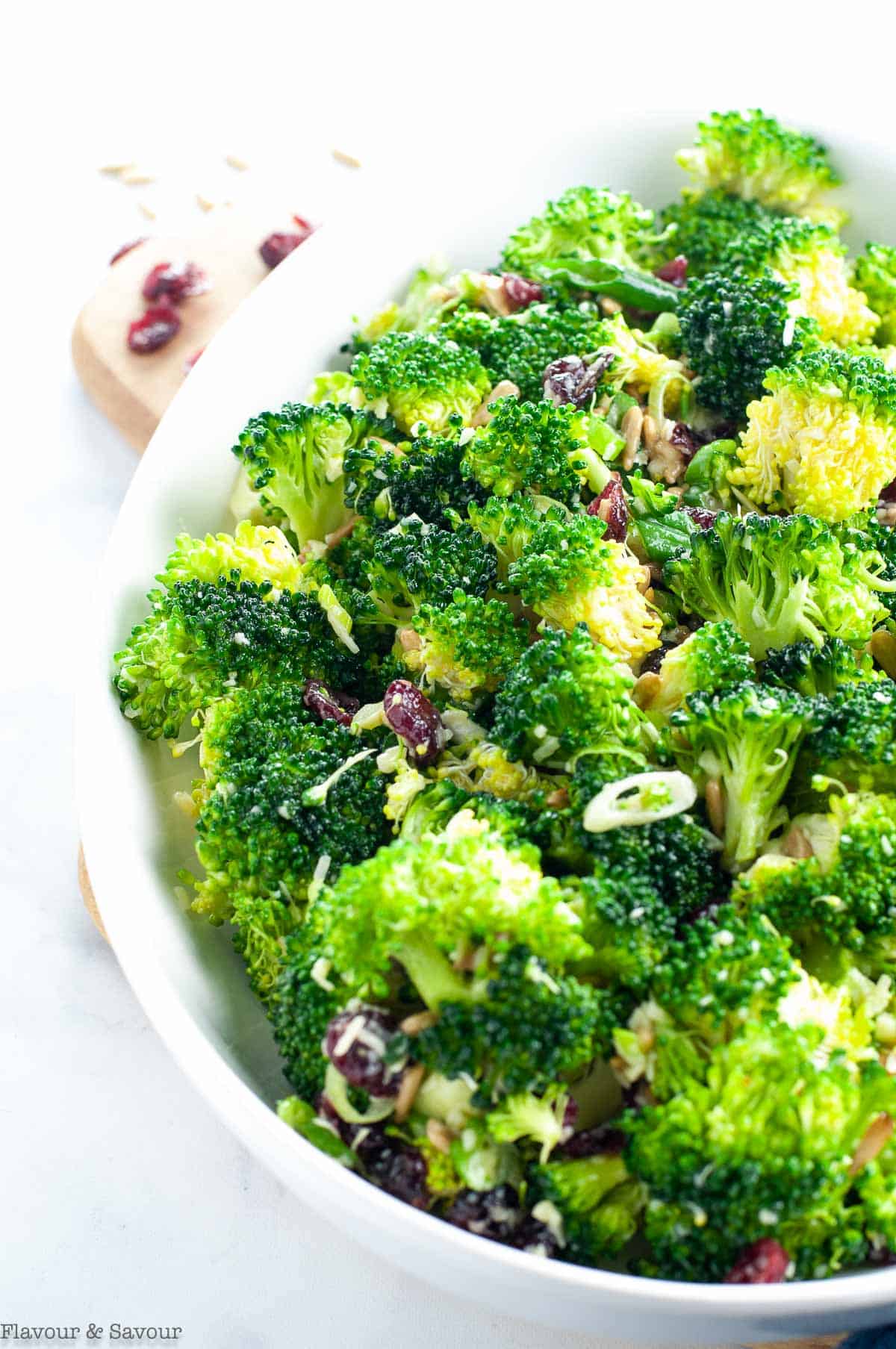 Honey-Dijon Broccoli Salad in a white oval bowl