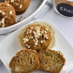 Close up view of Chai Spiced Roasted Pear Oat Muffins on a white plate