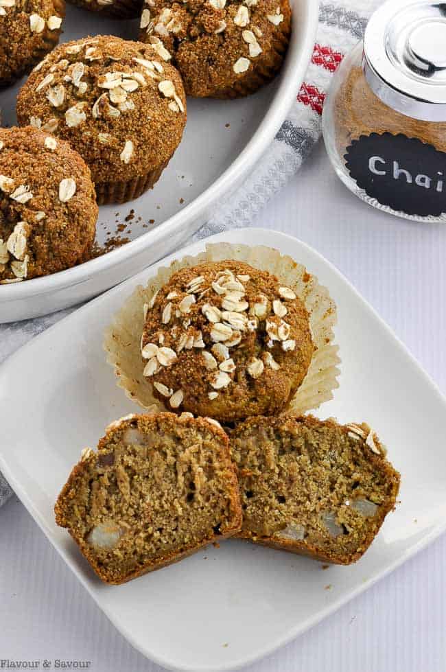 Close up view of Chai Spiced Roasted Pear Oat Muffins on a white plate