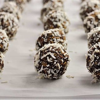 No Bake Chocolate Almond Snowballs on a baking sheet