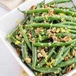 Skillet Parmesan Pecan Green Beans in a square white bowl