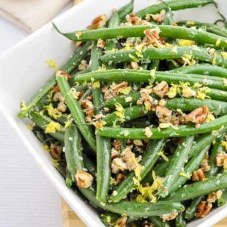 Skillet Parmesan Pecan Green Beans in a square white bowl