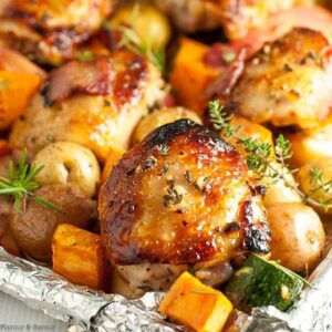 Roasted chicken thighs and vegetables on a sheet pan