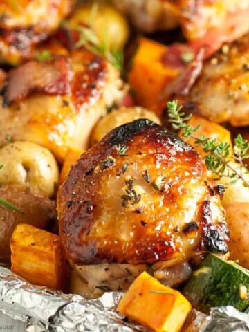 Roasted chicken thighs and vegetables on a sheet pan