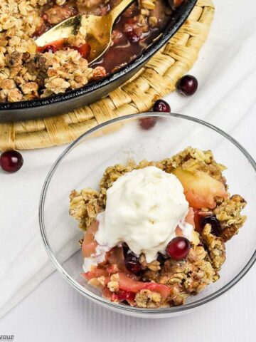 a bowl of Skillet Cranberry Apple Crisp